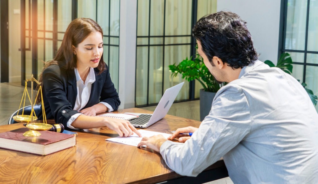 A trusts and estates lawyer speaking with a client about the 10 steps they can take to protect their child’s inheritance today.