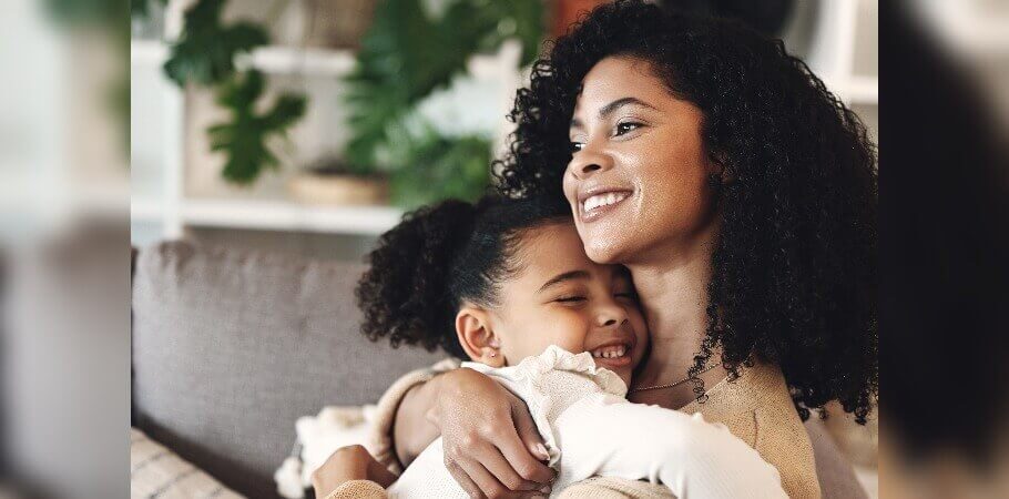 Mother hugging her daughter