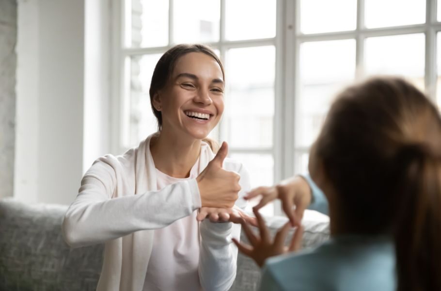 mother using ASL with her daughter