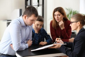 Parents and child meet with child support lawyer in Virginia Beach