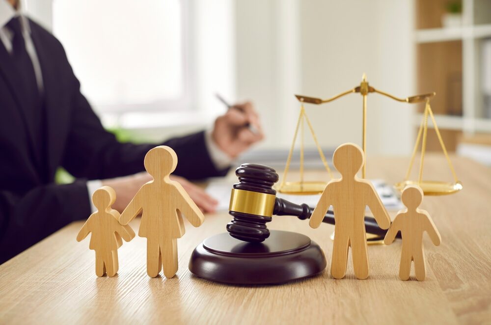 Wooden blocks of family and a gavel | Child Custody Navigation