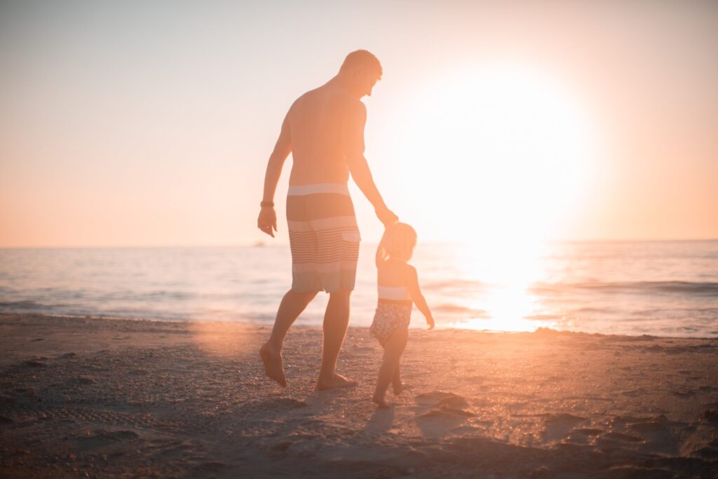 Father with daughter on a beach